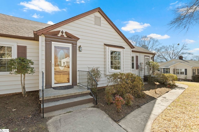 view of front of house featuring a shingled roof