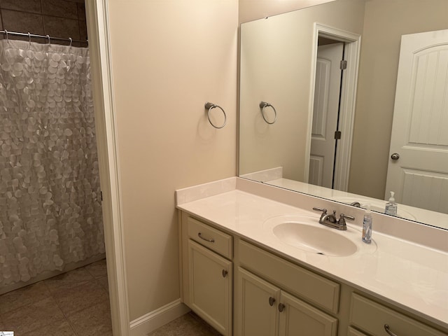 bathroom with baseboards, tile patterned floors, vanity, and a shower with curtain