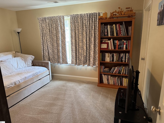 sitting room featuring carpet floors, visible vents, and baseboards