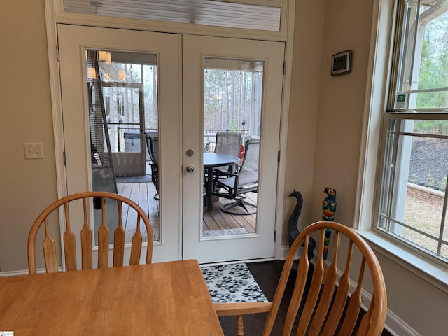 doorway with french doors and baseboards