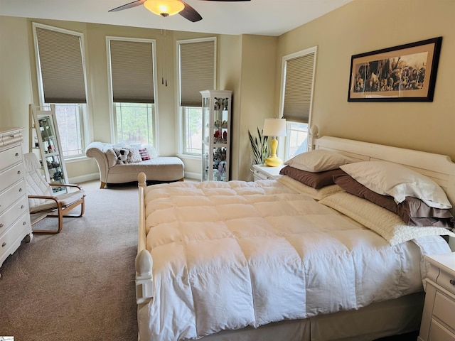 bedroom with carpet floors, baseboards, and a ceiling fan