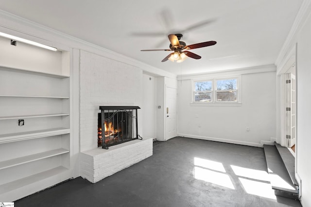 unfurnished living room featuring crown molding, a fireplace, a ceiling fan, concrete flooring, and baseboards