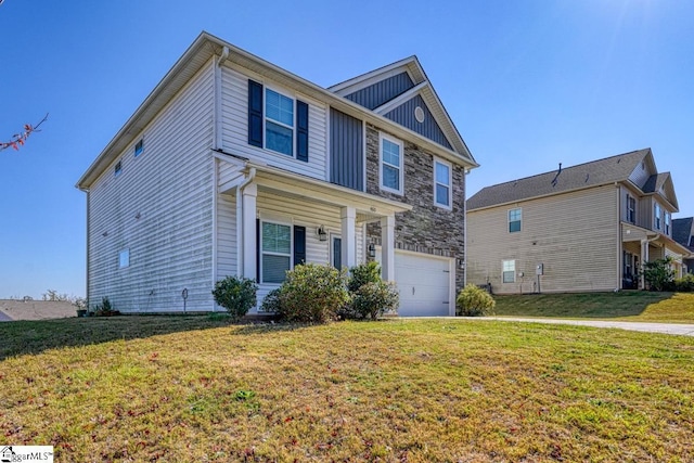 view of front facade with a front lawn, stone siding, and an attached garage