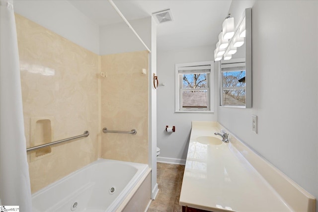 full bathroom featuring toilet, visible vents, vanity, baseboards, and a combined bath / shower with jetted tub