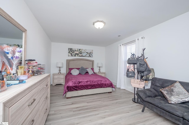 bedroom with light wood finished floors