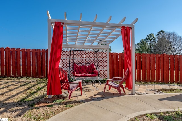 view of patio / terrace with a fenced backyard and a pergola