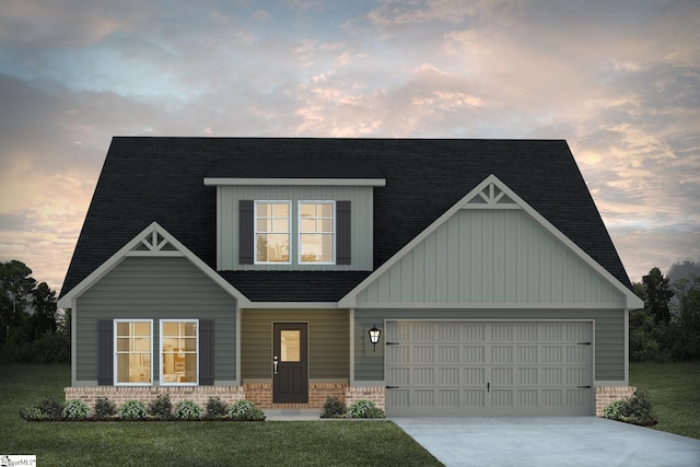 craftsman inspired home featuring a garage, concrete driveway, brick siding, and a lawn