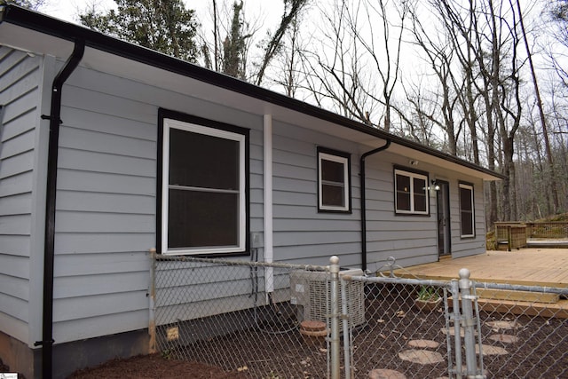 view of property exterior featuring fence