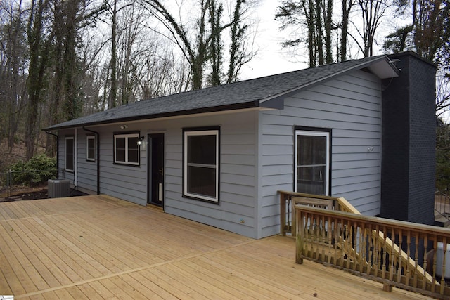 wooden terrace featuring central air condition unit