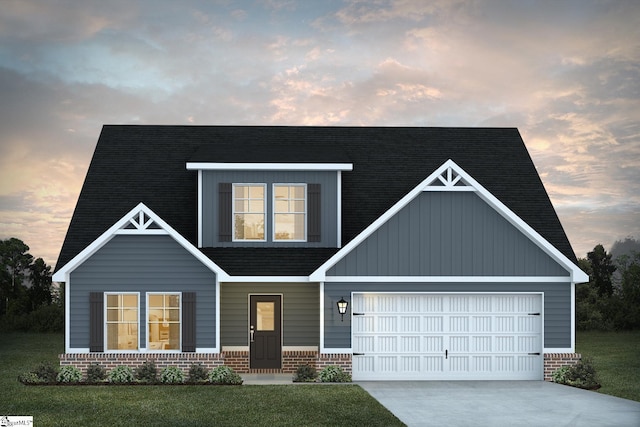 view of front facade featuring a garage, concrete driveway, brick siding, and a front lawn