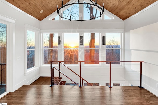 unfurnished sunroom featuring lofted ceiling and wooden ceiling