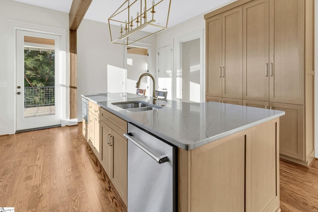 kitchen with light wood-style flooring, stainless steel dishwasher, a sink, an island with sink, and light stone countertops