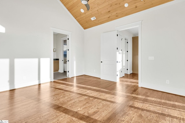 spare room featuring a ceiling fan, wood ceiling, baseboards, and wood finished floors