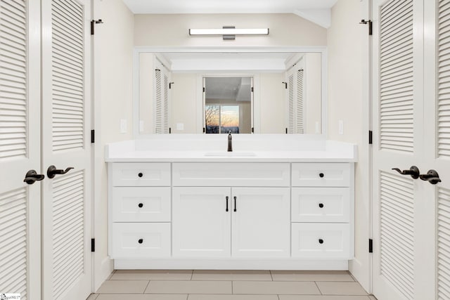 bathroom featuring a closet and vanity