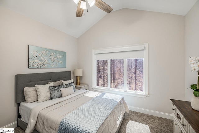 carpeted bedroom featuring a ceiling fan, vaulted ceiling, and baseboards