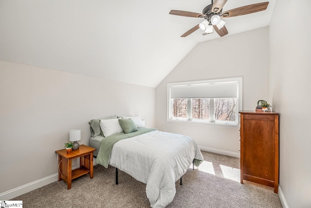 bedroom with light carpet, ceiling fan, baseboards, and vaulted ceiling