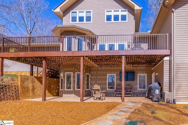 back of house featuring a patio area