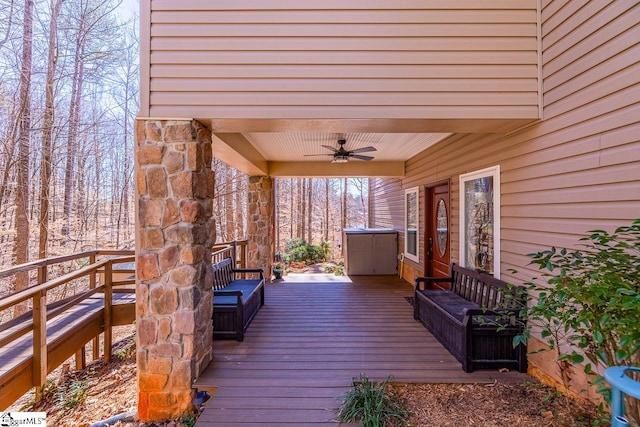 wooden terrace featuring ceiling fan and covered porch