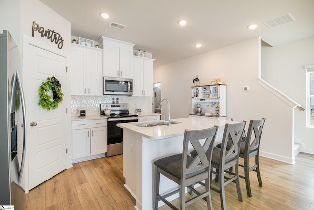 107 Tramore Ln, Fountain Inn, SC 29644 - kitchen with a sink, visible vents, an island with sink, and appliances with stainless steel finishes
