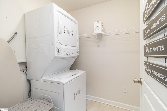 107 Tramore Ln, Fountain Inn, SC 29644 - laundry area featuring stacked washer and clothes dryer, baseboards, and laundry area