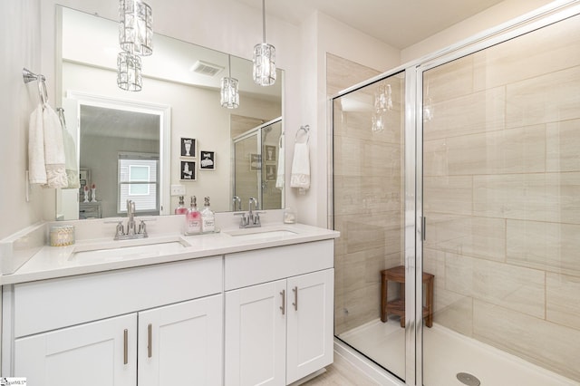 107 Tramore Ln, Fountain Inn, SC 29644 - full bathroom featuring a shower stall, double vanity, visible vents, and a sink