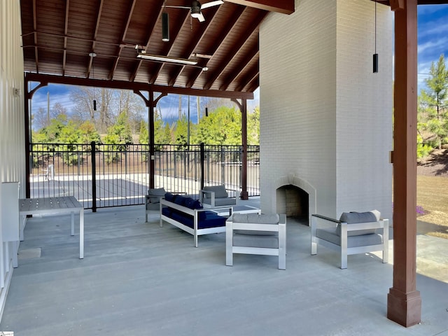 107 Tramore Ln, Fountain Inn, SC 29644 - view of patio featuring an outdoor living space with a fireplace, fence, and a ceiling fan
