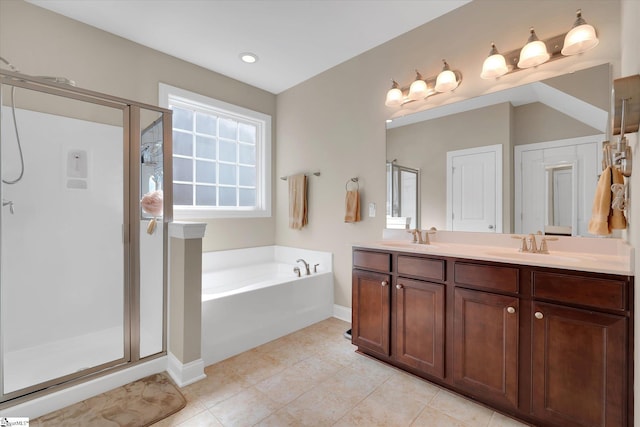 full bath featuring double vanity, a garden tub, a shower stall, and a sink