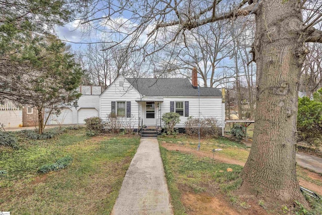 view of front of home featuring a shingled roof, a chimney, and an attached garage