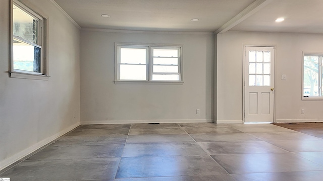 empty room featuring crown molding, recessed lighting, and baseboards