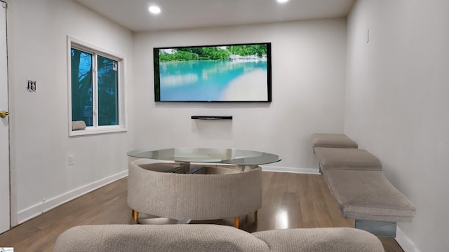 interior space with recessed lighting, baseboards, and wood finished floors