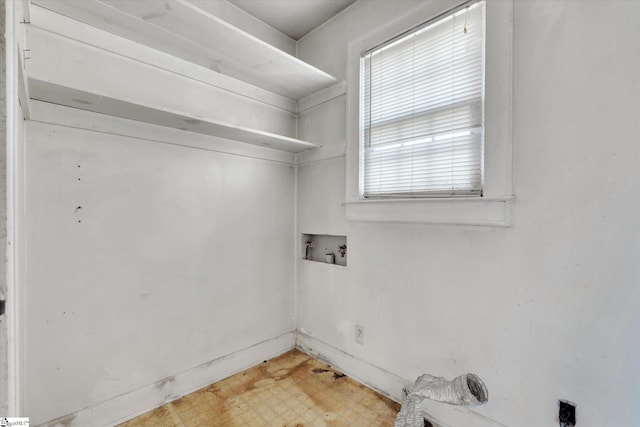 washroom with washer hookup, laundry area, and light floors