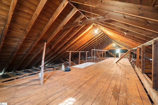 attic featuring an upstairs landing