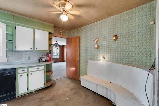 kitchen featuring unfinished concrete flooring, open shelves, light countertops, white cabinets, and dishwasher