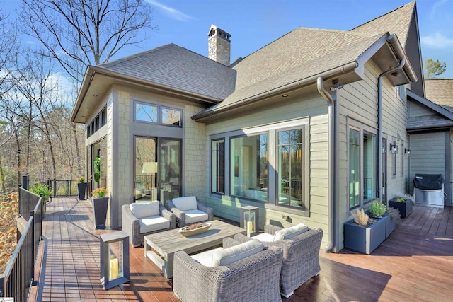 deck with outdoor lounge area and a grill