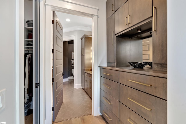 spacious closet featuring parquet flooring