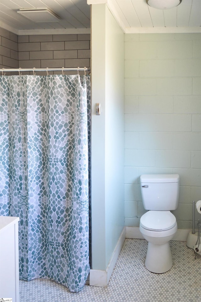612 W Main St, Easley, SC 29640 - full bath with curtained shower, tile patterned flooring, and toilet