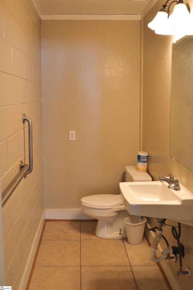 612 W Main St, Easley, SC 29640 - bathroom with baseboards, a sink, toilet, and tile patterned floors
