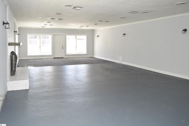 612 W Main St, Easley, SC 29640 - unfurnished room with finished concrete flooring, baseboards, a fireplace, and ornamental molding
