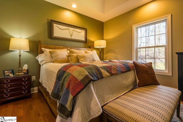 bedroom with recessed lighting, baseboards, and wood finished floors