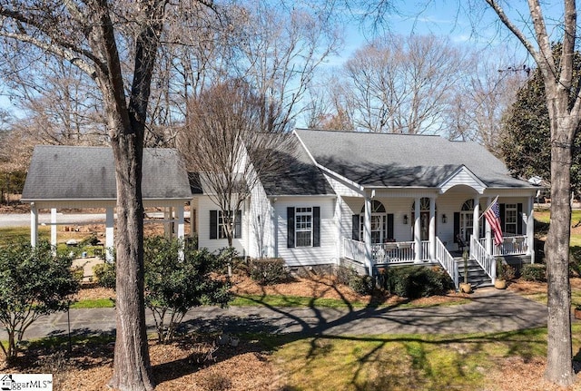 view of front facade featuring a porch and a shingled roof