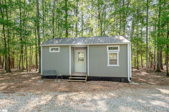 view of outbuilding with entry steps and an outbuilding