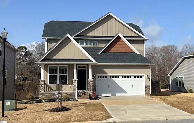 craftsman-style home featuring covered porch, concrete driveway, and a shingled roof