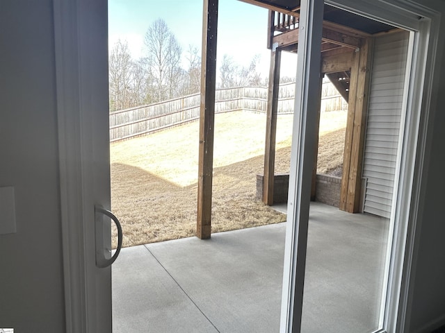 doorway featuring concrete flooring and a wealth of natural light