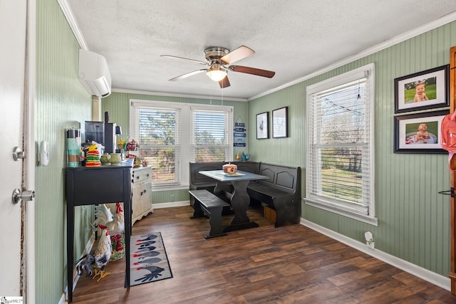 dining area with a textured ceiling, a wall mounted air conditioner, wood finished floors, and crown molding