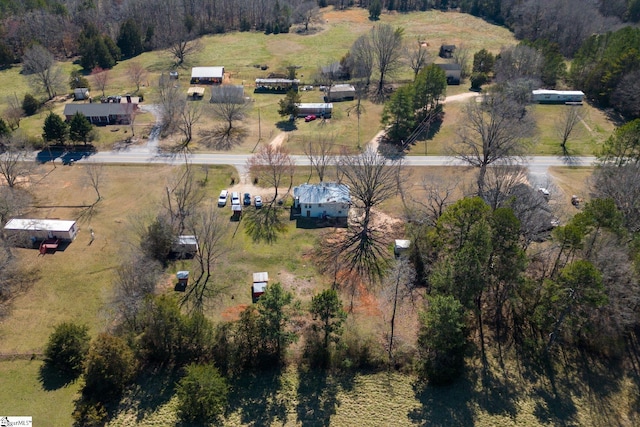 birds eye view of property featuring a rural view