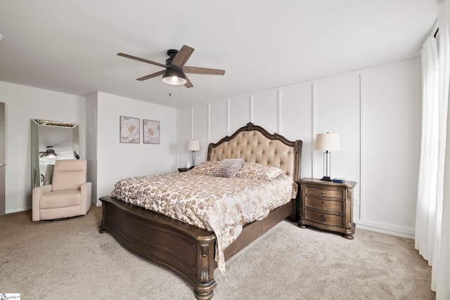 bedroom featuring a ceiling fan and light colored carpet