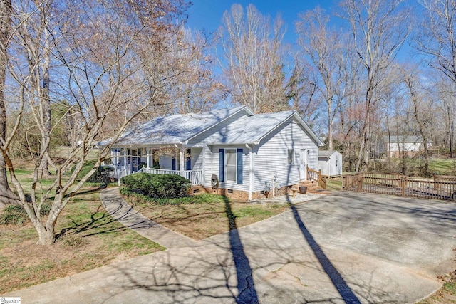 view of front of house with a porch, crawl space, and driveway