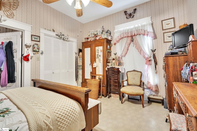 bedroom featuring ceiling fan, tile patterned floors, and wallpapered walls