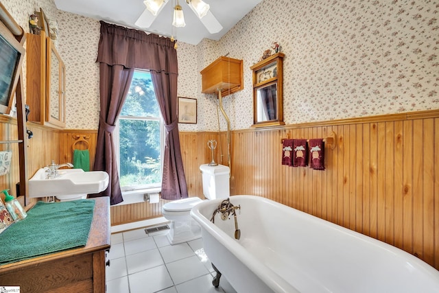 full bath with wainscoting, visible vents, and wallpapered walls