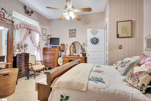 bedroom featuring a ceiling fan and wallpapered walls